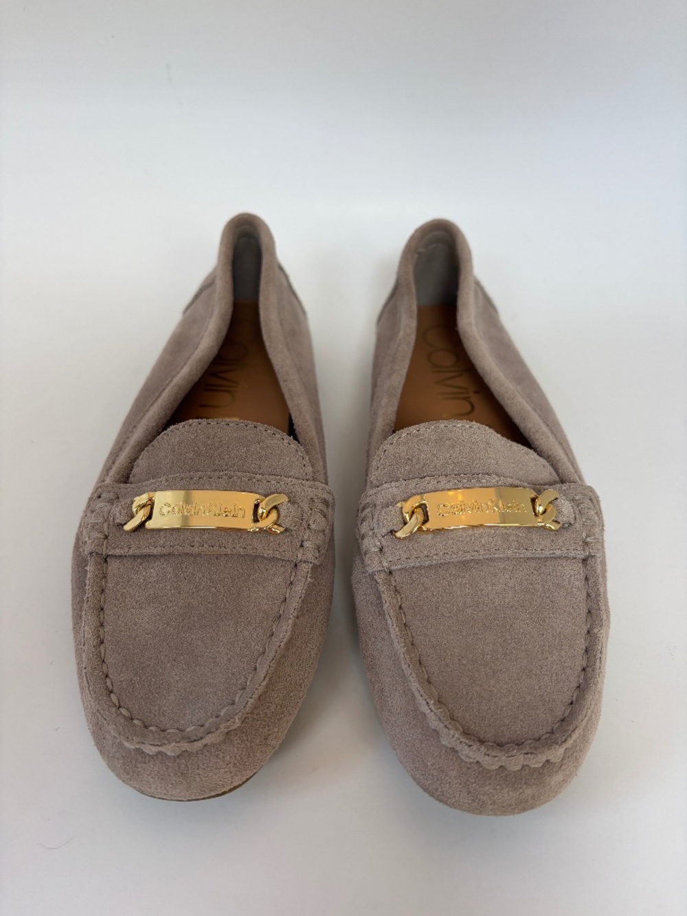 Calvin Klein Lunasi Moccasins in a Gray Suede with gold-tone logo bar, Size 6